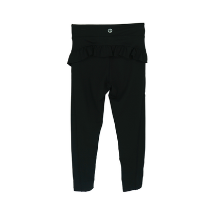 girls leggings with ruffle black flat lay back