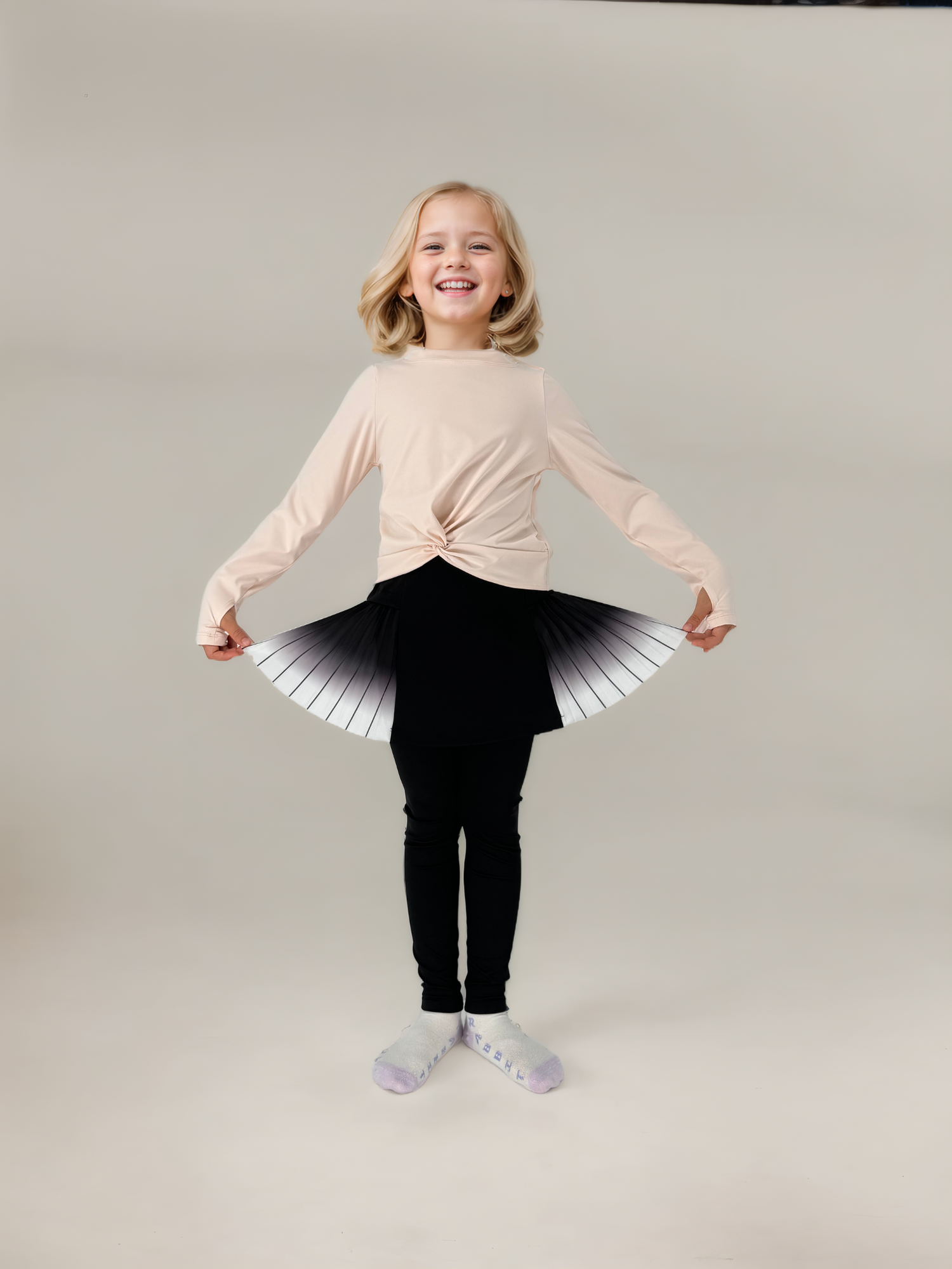 girls black leggings with pleated skirt and pink long sleeve tee