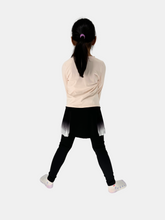girls black leggings with pleated skirt model back